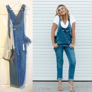 The Mumsie Baby Wearing Overalls